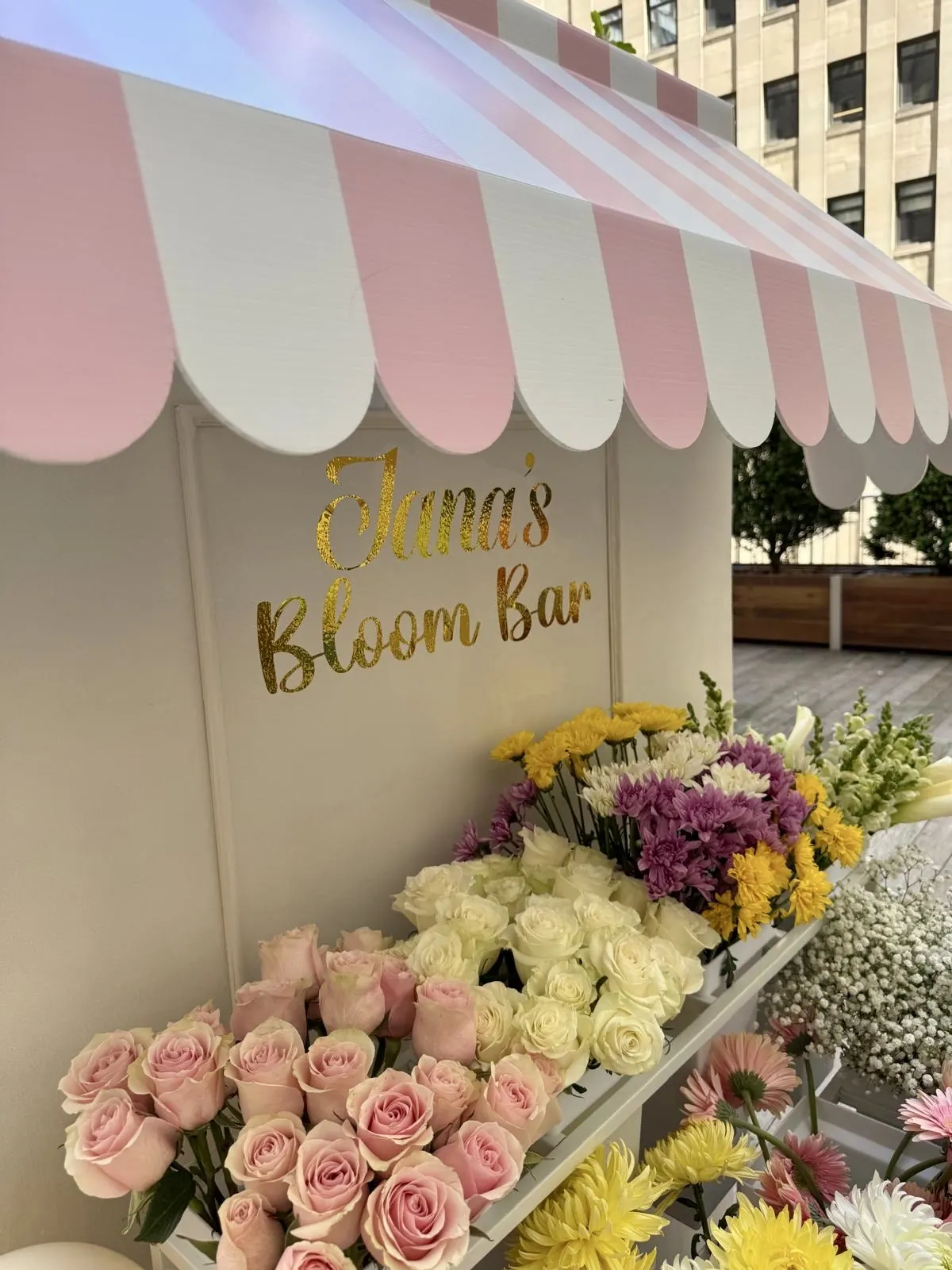 Bloom bar with a striped awning